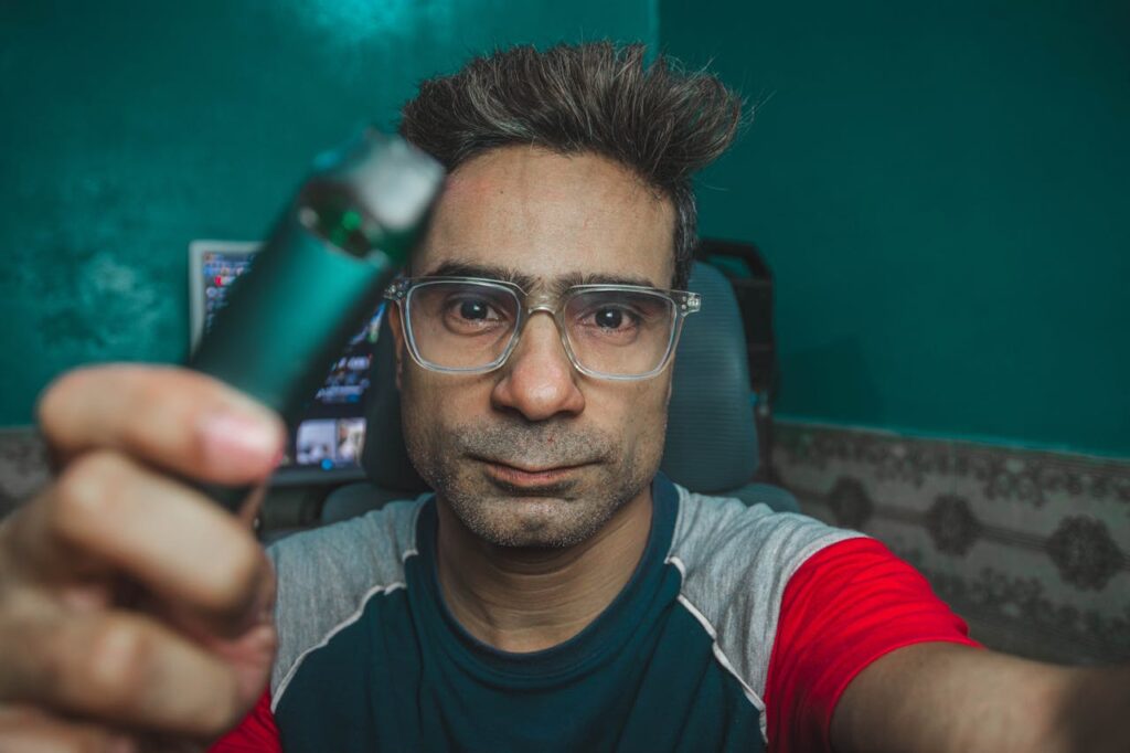 Man with Eyeglasses Sitting in Room